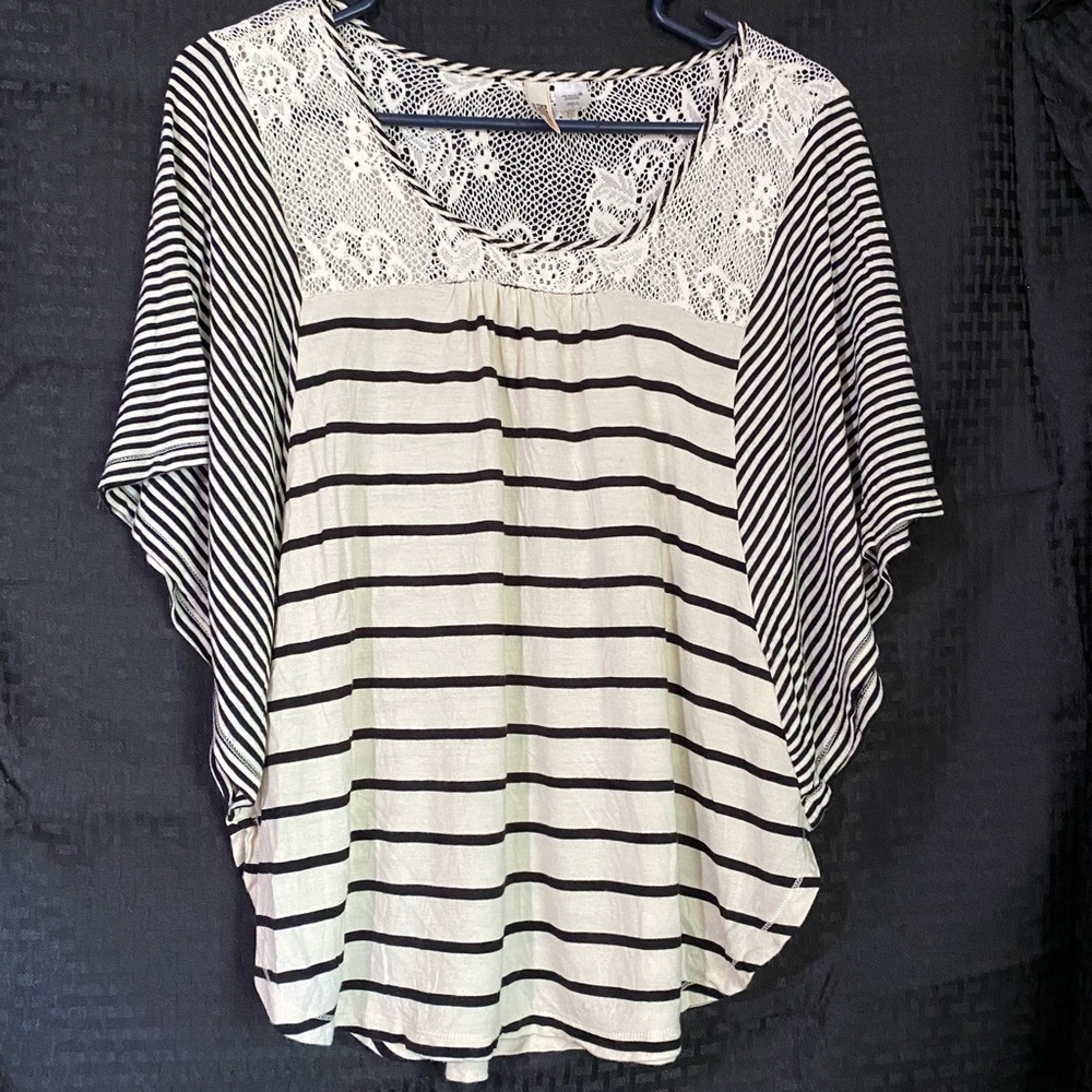 Flowy white top with black stripes and lace detail